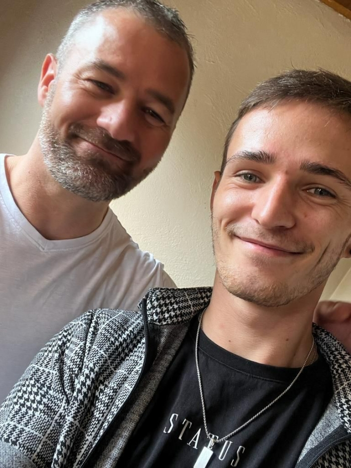 Rob and his son Toby are pictured together, smiling at the camera.jpg