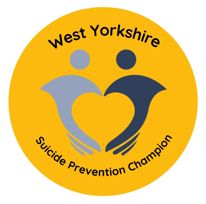 Image shows the yellow circular logo of the Suicide Prevention Champion.jpg