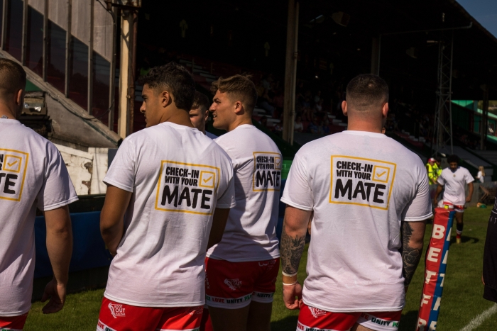 Keighley Couger players wearing T shirts with Check In With Your Mate campaign on the back.jpg